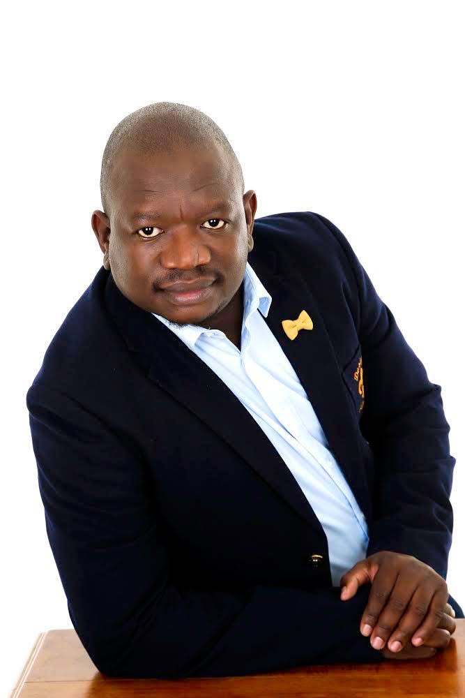 Sifiso Khanyile in navy blazer and gold bowtie